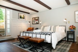 King-sized bed near its private entrance in Room 3
