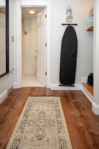 Rug in the dressing area leading to the bathroom of Room 3