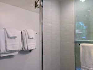 room 1 bathroom shower door Queen Bed with Private Entrance: Room 1