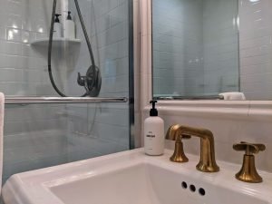room 1 bathroom sink shower Queen Bed with Private Entrance: Room 1
