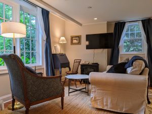 room 1 sitting area desk TV Queen Bed with Private Entrance: Room 1