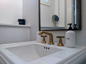 room 2 bathroom sink makeup mirror Private Entrance, King Bed, Close to Pool: Room 2