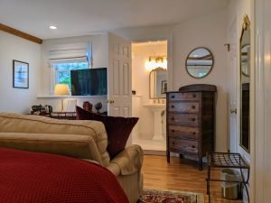 room 2 bed couch back bathroom sink Private Entrance, King Bed, Close to Pool: Room 2