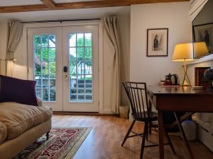 room 2 sitting area towards closed door Private Entrance, King Bed, Close to Pool: Room 2