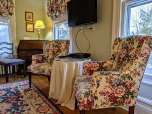Historic Room With Queen Bed And Spacious Bath: Room 26 8 room 26 sitting area tv desk scaled 1 Historic Room with Queen Bed and Spacious Bath: Room 26