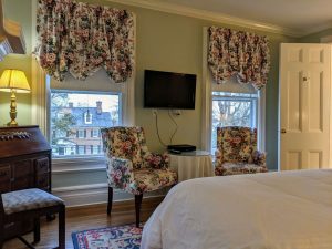 Historic Room With Queen Bed And Spacious Bath: Room 26 4 room 26 sitting area tv view scaled 1 Historic Room with Queen Bed and Spacious Bath: Room 26
