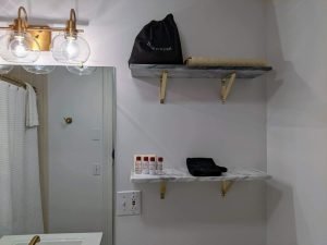 Historic Guest Room With A King Bed | Room 27 13 room 27 bathroom shelves scaled 1 Historic Guest Room with a King Bed | Room 27