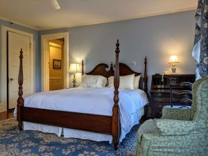 Historic Guest Room With A King Bed | Room 27 6 room 27 bed towards door scaled 1 Historic Guest Room with a King Bed | Room 27