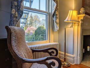 Historic Guest Room With A King Bed | Room 27 10 room 27 rocking chair garden view scaled 1 Historic Guest Room with a King Bed | Room 27