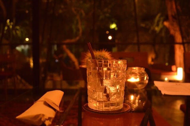 glass lit by candlelight