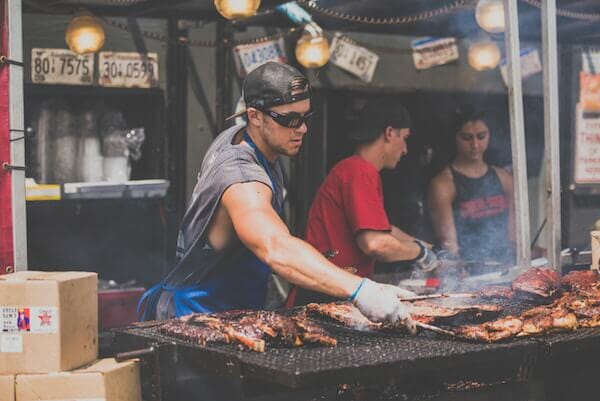 man grilling barbecue during labor day weekend near greenwich ct