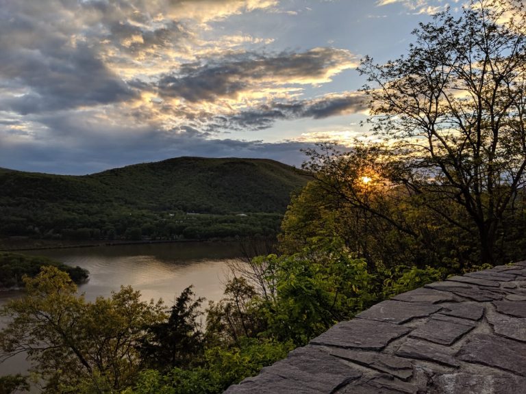 sunset over the hudson river from the road near bear mountain state park, one of the options for hiking trails near greenwich ct and nyc