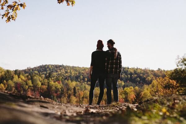 couple enjoying fall activities in CT like hiking to see CT fall foliage