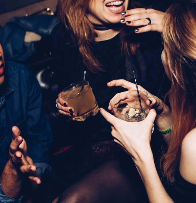 friends out chatting while enjoying the best things to do in greenwich ct at night