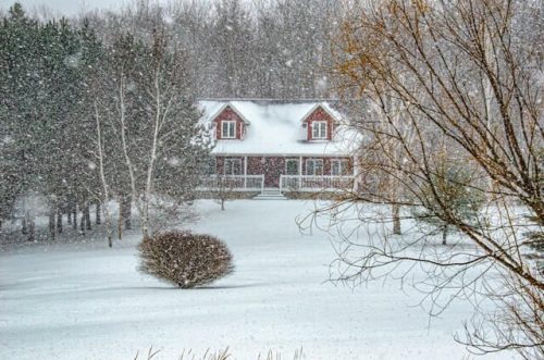 fresh snowfall around a house
