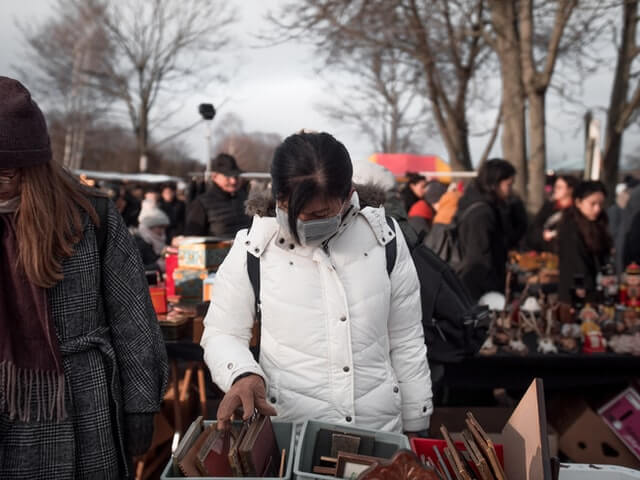 masked shopper at one of the flea markets in CT in winter