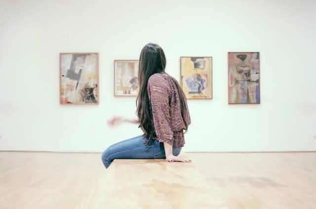 woman viewing art at a museum