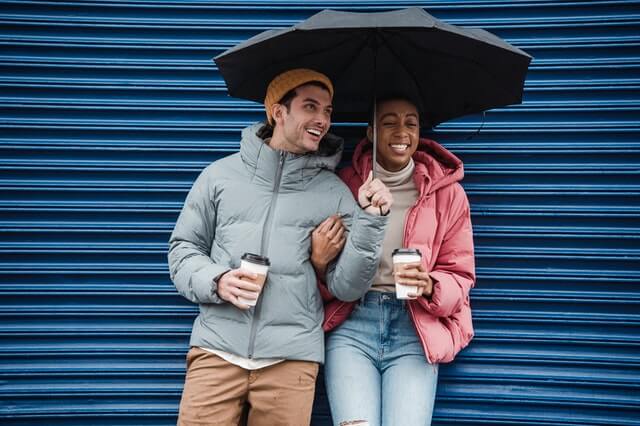 couple under an umbrella, looking for indoor activities in CT