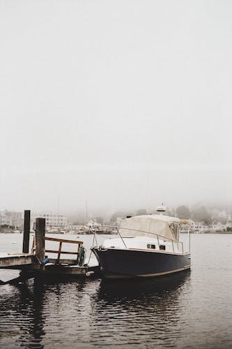 A boat covered in show while exploring Mystic on the list of things to do in Connecticut in February