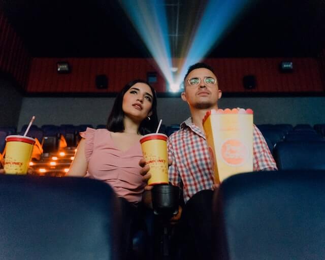 couple watching a movie at the avon theatre film center in stamford ct