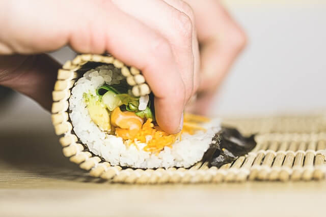chef rolling sushi at Miku Sushi in Greenwich CT