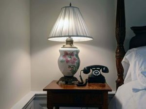 room 20 brush suite nightstand lamp scaled 1 King Suite with a Clawfoot Tub: The Brush Suite