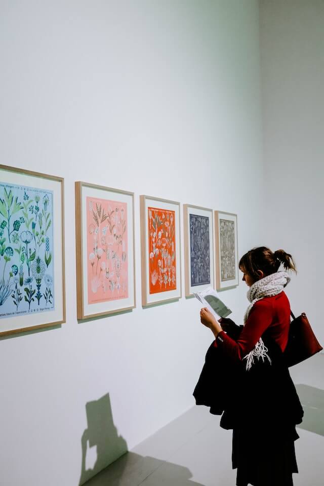 woman looking at colorful art