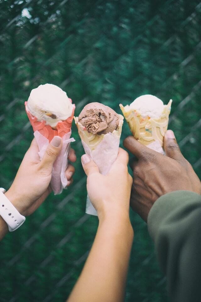 people holding ice cream