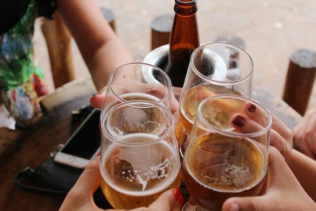 People enjoying a glass of hard apple cider
