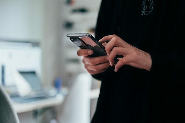 Hotel guest using their smartphone