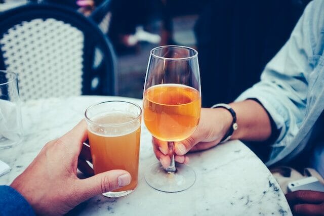 Enjoying a glass of sweet cider with pineapple and tart flavors