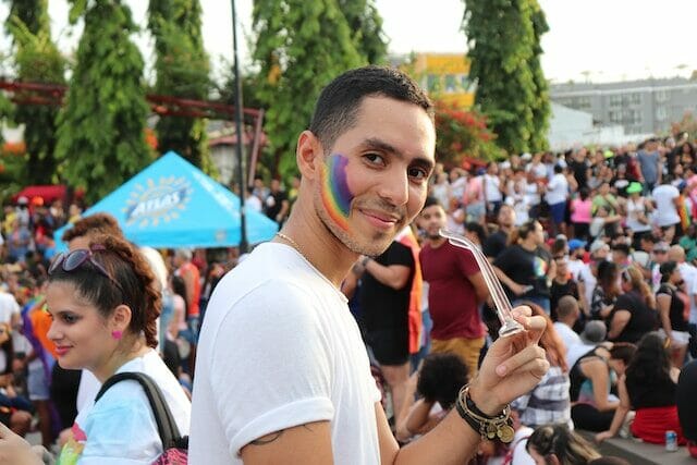 Solo visitor enjoying a pride event