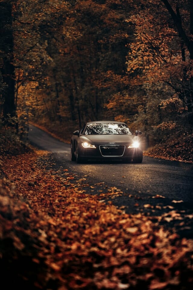 luxury car along one of the most beautiful Connecticut fall foliage driving routes