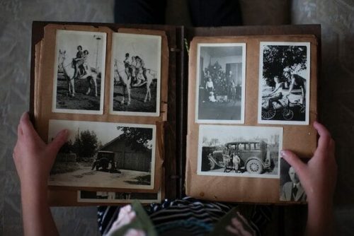 Family members pouring over old photo albums