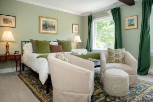 Seating area in front of the king bed in Room 12