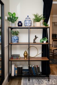 Bookcase of books and nick nacks in Room 5