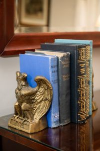 Books and a patriotic bookend in the Sackett Suite