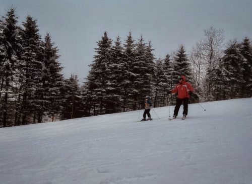 A family skiing together at one of the top ski resorts for families in New York City