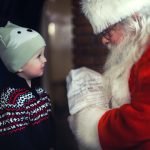 Child meeting Santa on a holiday train ride, on a polar express train ride near NYC