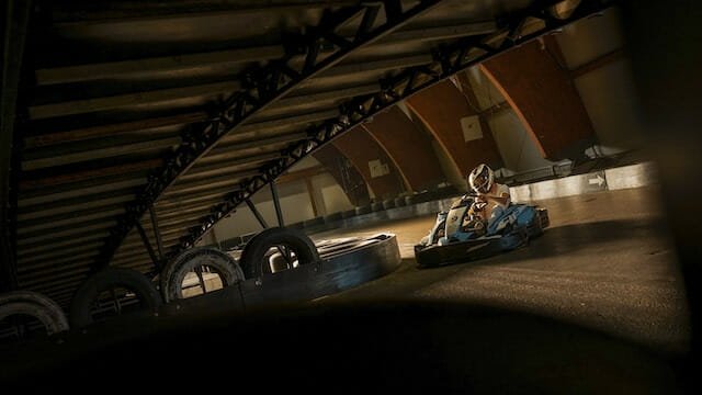 Kids enjoying indoor go kart racing
