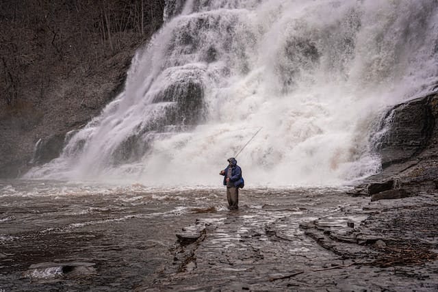Fisherman in front of Ithaca Falls