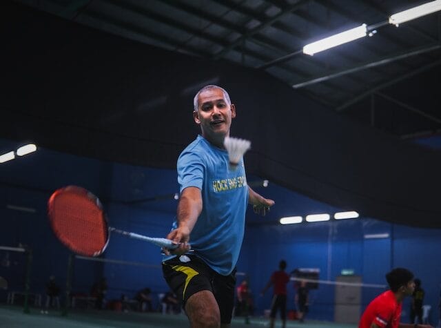 A man playing badminton