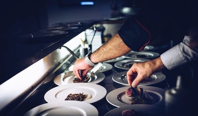 Chef plating a dish at a Norwich area restaurant