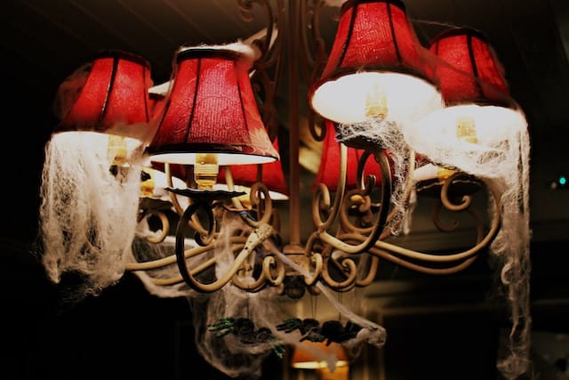 Cobwebs on a chandelier in a haunted house