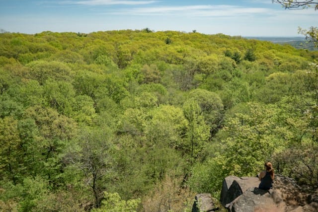 Hiker admiring the view at Sleeping Giant State Park