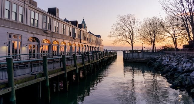Sunset image of New York harbor from Battery Park