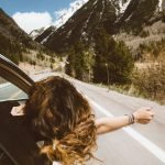 Summer Road Trips From Nyc: Top 27 Most Unique Spots 27 woman heading out on one of the best summer road trips from NYC
