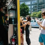 New York City food truck serving customers during the summer in NYC