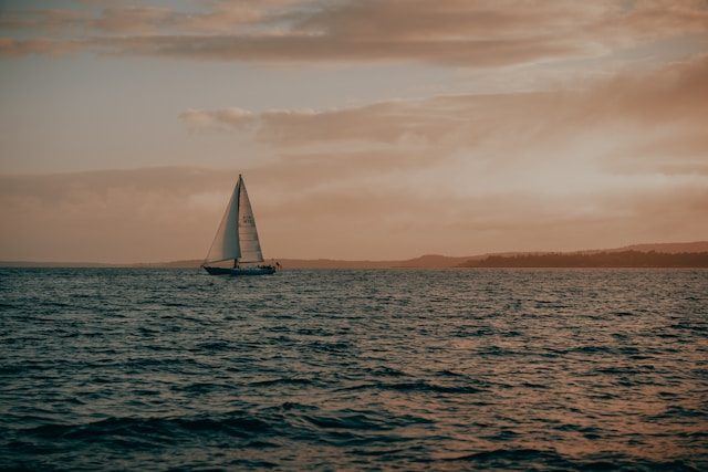 Sailboat at dusk off the coast of Camden, ME