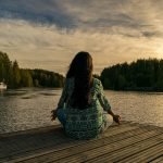 A woman focuses on her breathing at a top Hudson Valley yoga retreat